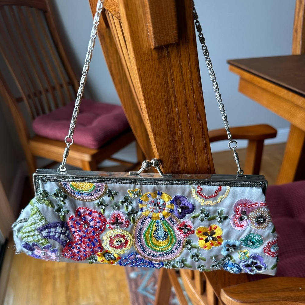 Small Bandolino frabric clutch with beautiful beading and shoulder strap.